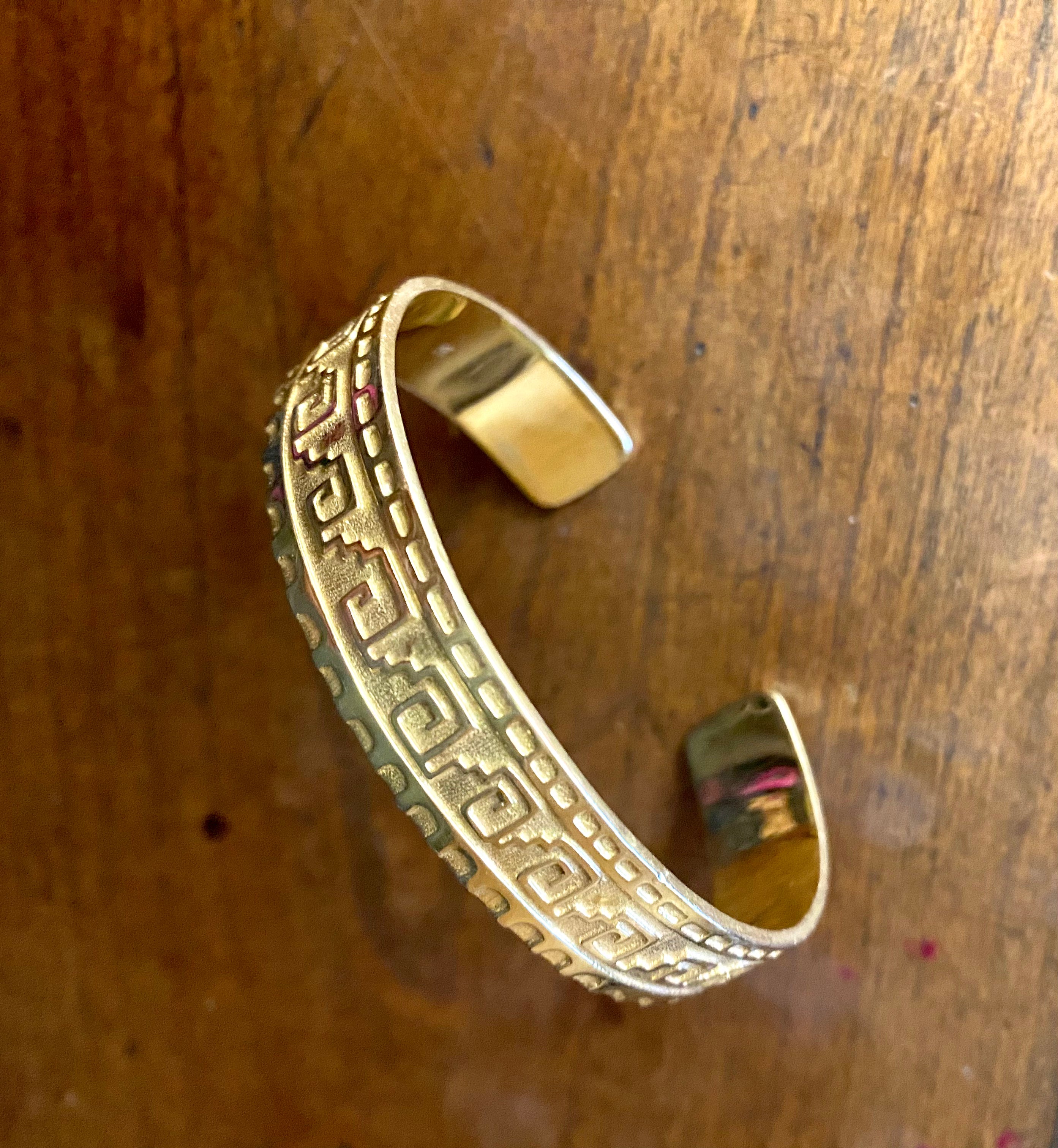 Gold Zapotec bangle by fine jewelry designer Jade Jagger