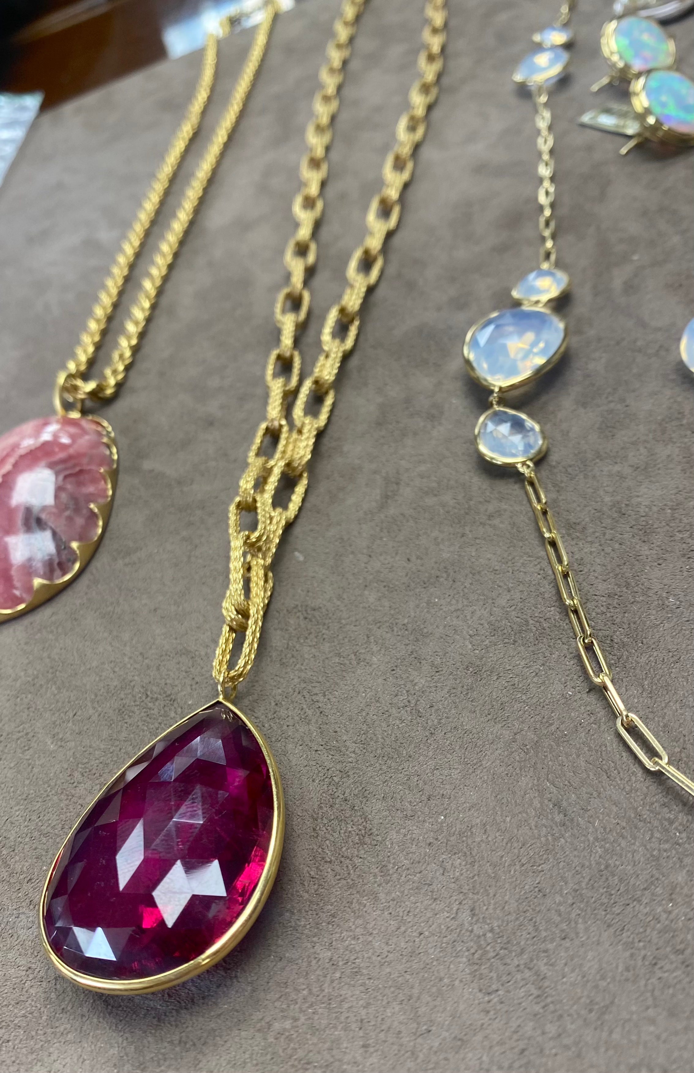 Rubellite pendant with a large texture solid 18 karat gold chain by fine jewelry designer Goshwara