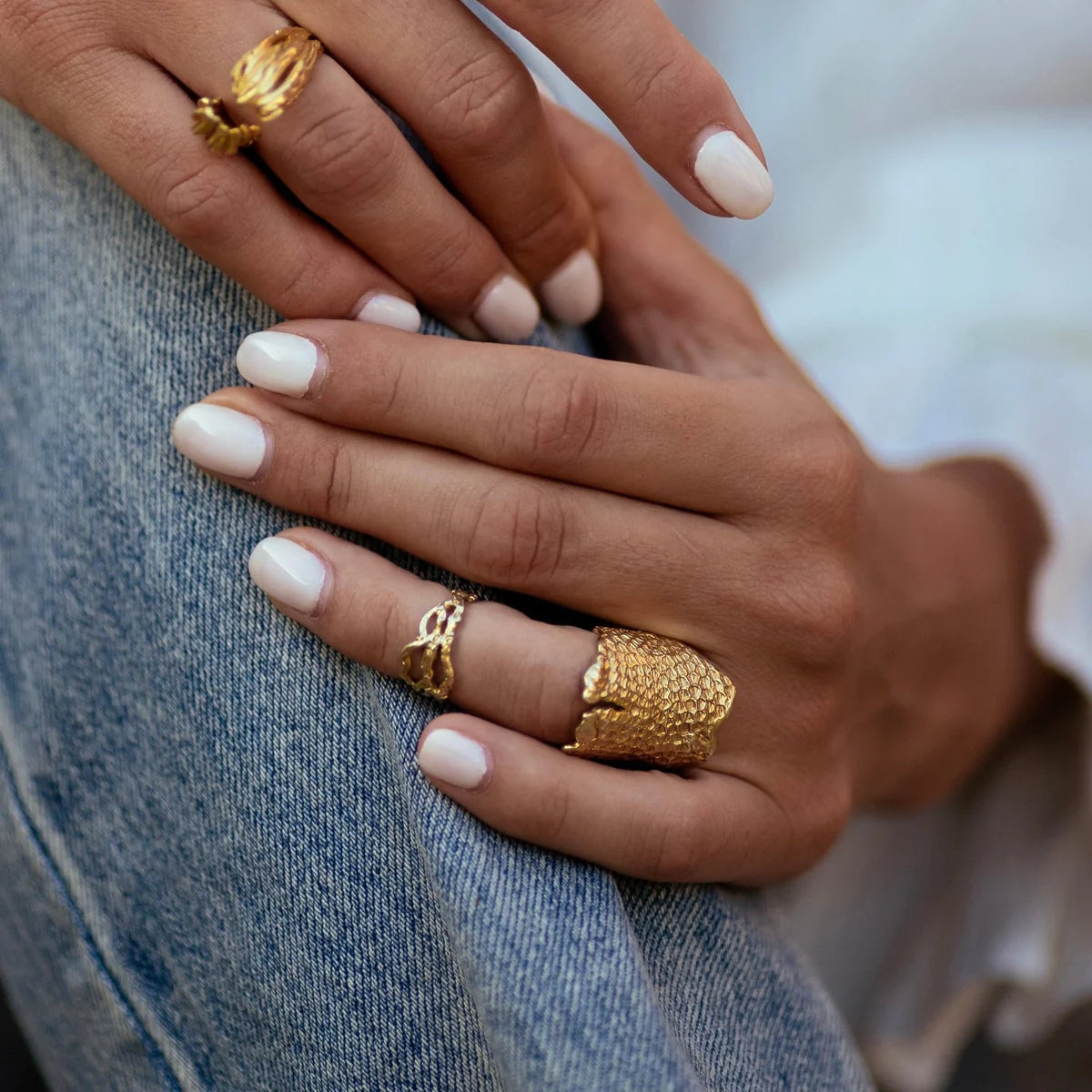 Gold texture dragon armour ring by jewelry designer Clio Saskia