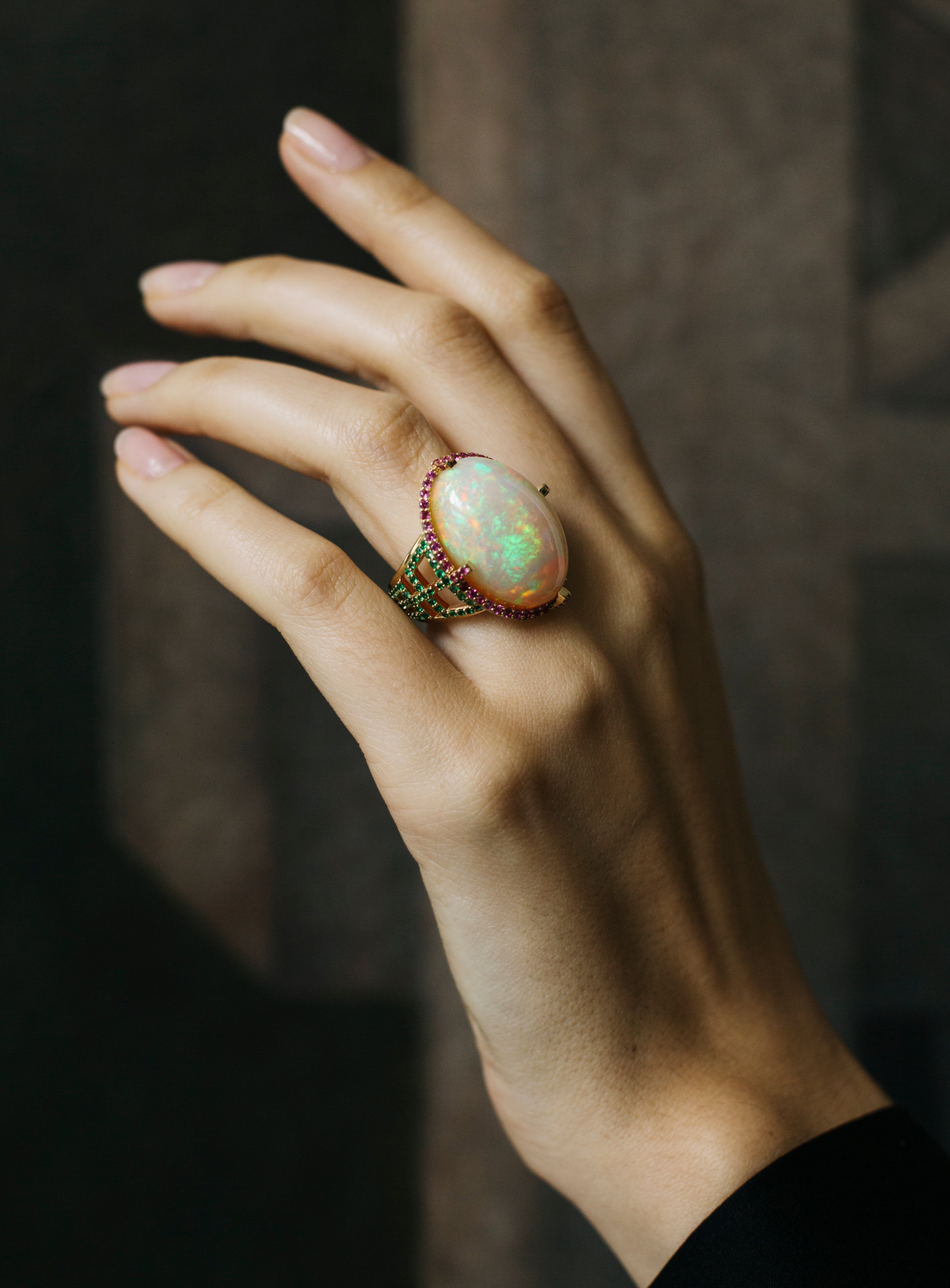 Opal cab ring with Pink Sapphire and Tsavorite in 18 karat yellow gold by fine jewelry designer Goshwara