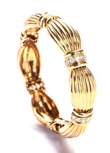 18 karat Gold Ribbon Bracelet with Diamonds by fine jewelry designer ESTAA