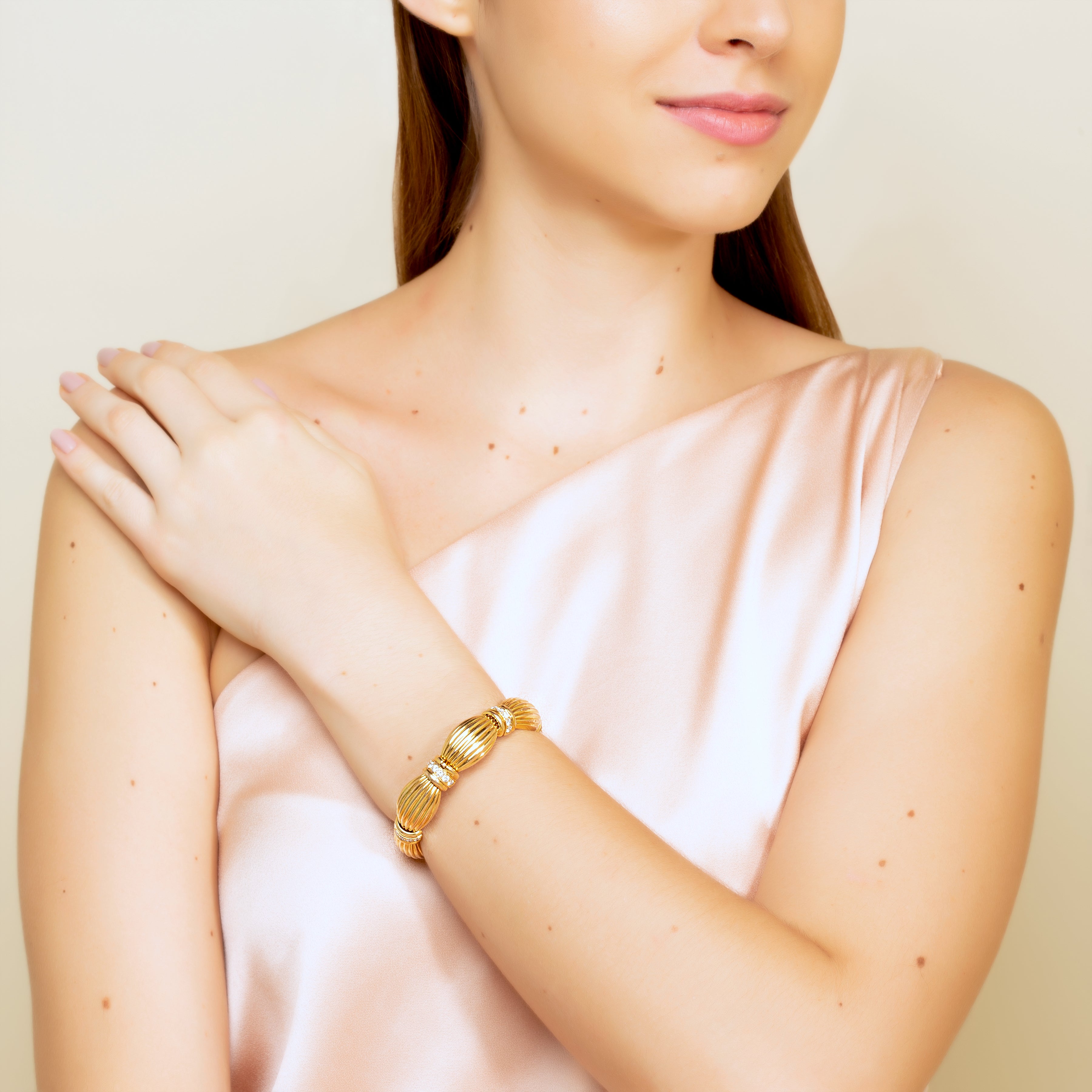 18 karat Gold Ribbon Bracelet with Diamonds by fine jewelry designer ESTAA