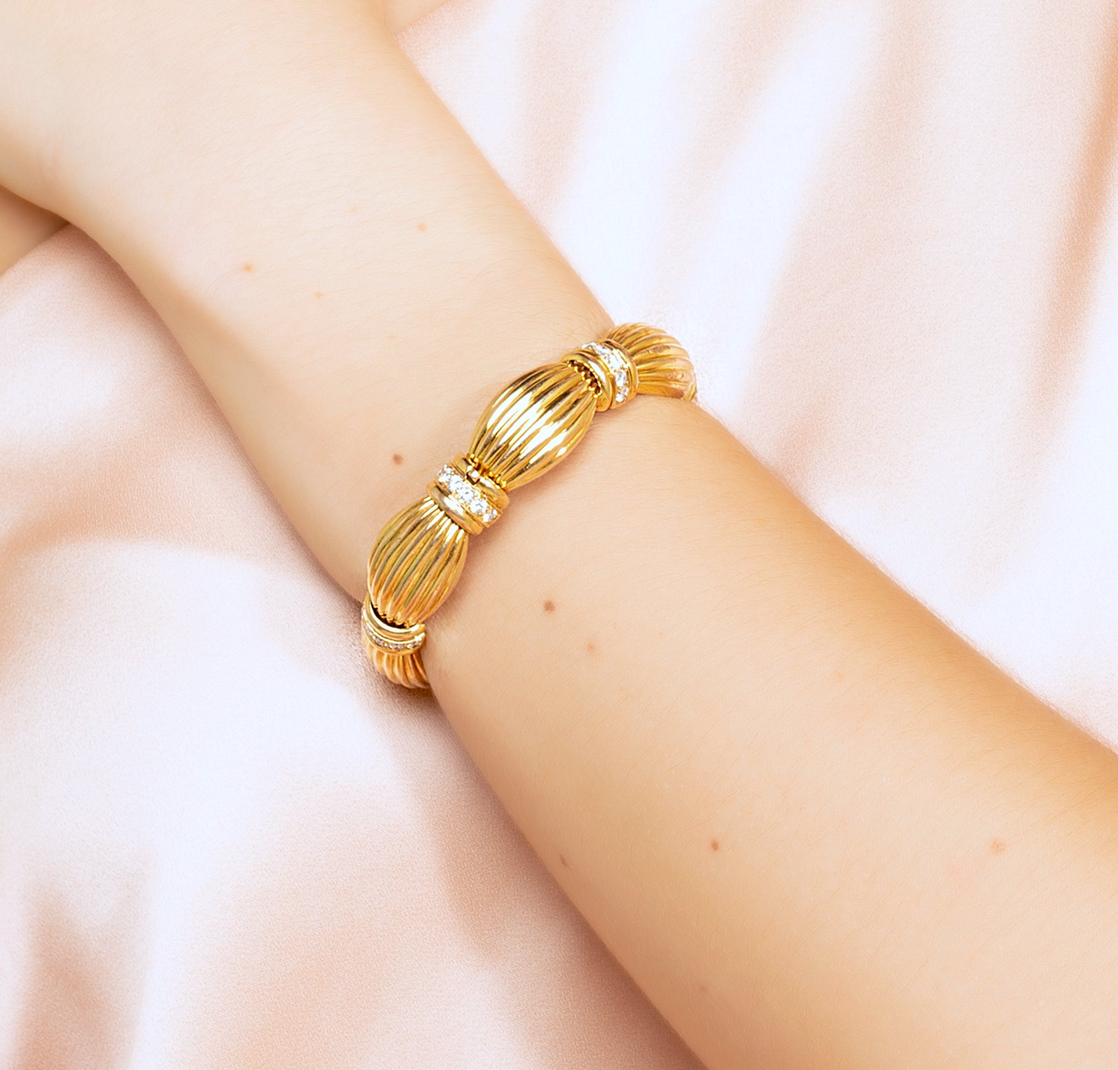 18 karat Gold Ribbon Bracelet with Diamonds by fine jewelry designer ESTAA