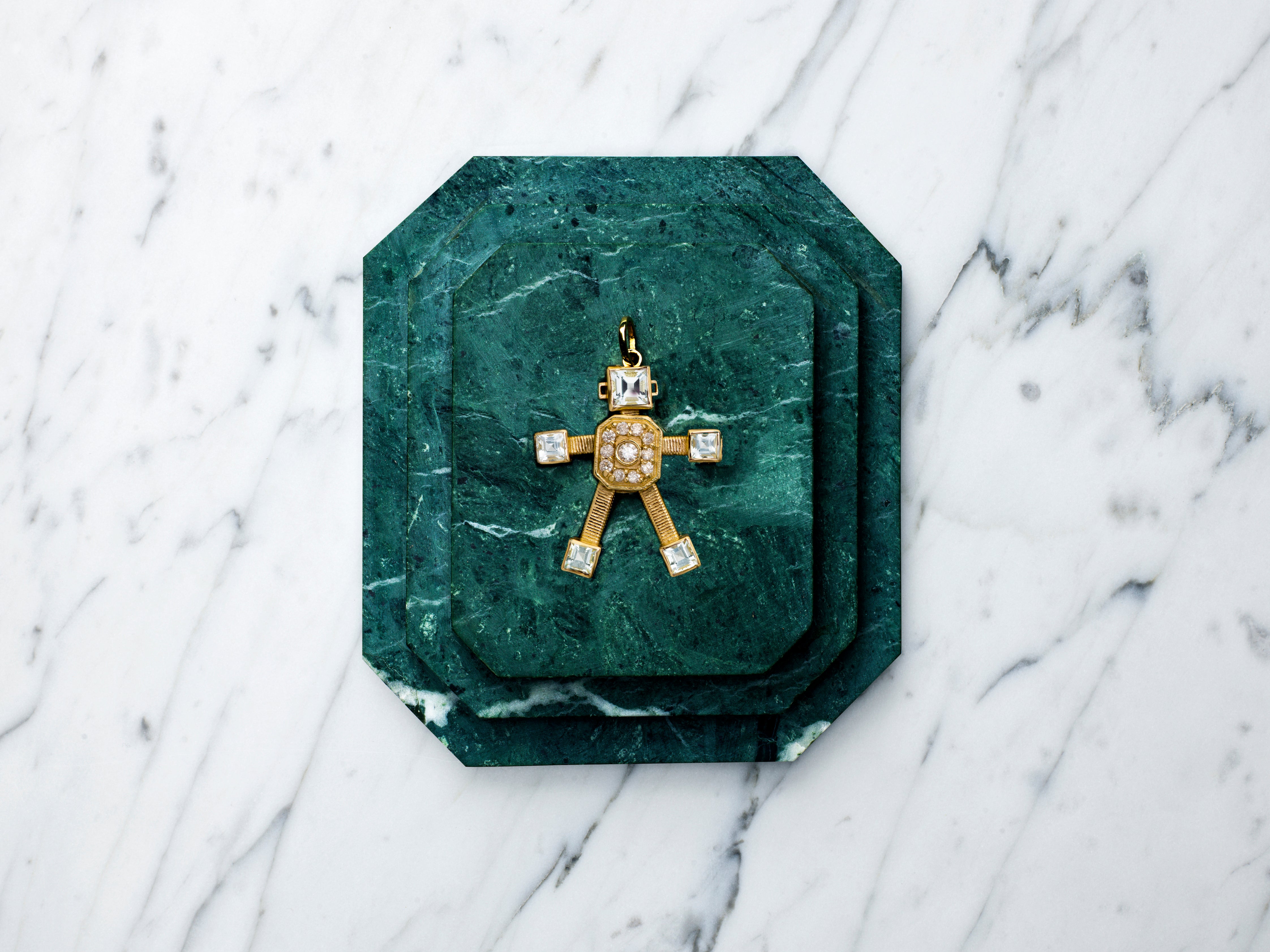 18 karat yellow gold articulated small robot pendant by fine jewelry designer Tatiana Van Lancker