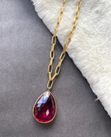 Rubellite pendant with a large texture solid 18 karat gold chain by fine jewelry designer Goshwara