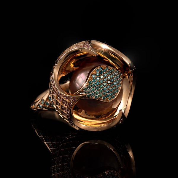 18 karat rose gold ring with natural Pink Pearl in a lattice, with white, pink, and blue diamonds. Collectible high jewelry by NIgel O'Reilly
