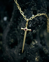 Gold ruby sword pendant by fine jewelry designer Linda Hoj