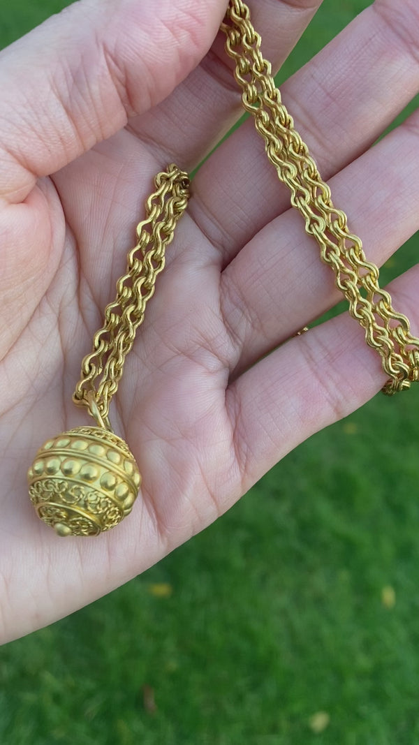 Ball pendant and chain in 22 karat gold necklace by fine jewelry designer Linda Hoj. 