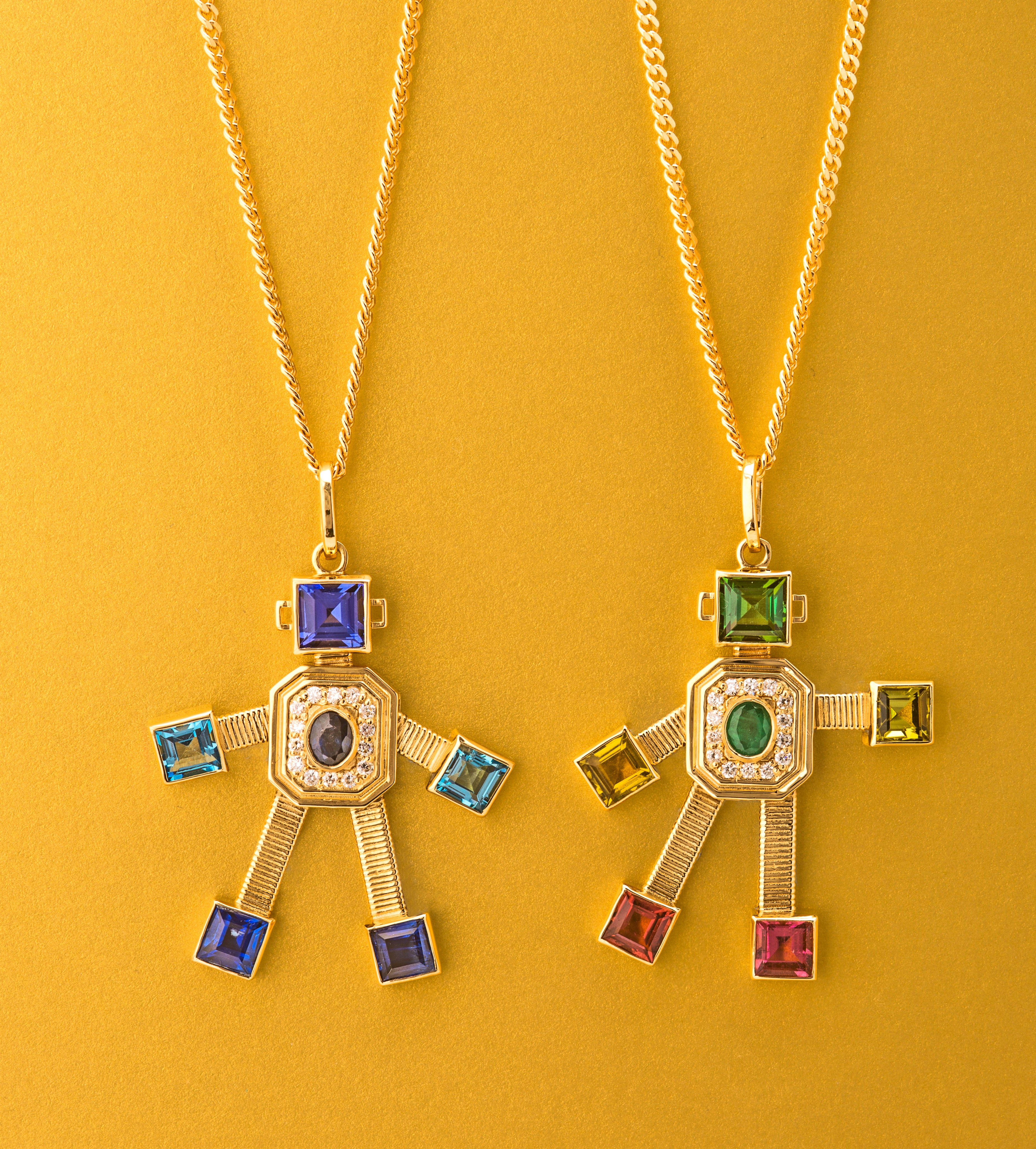 18 karat yellow gold articulated robot pendant by fine jewelry designer Tatiana Van Lancker