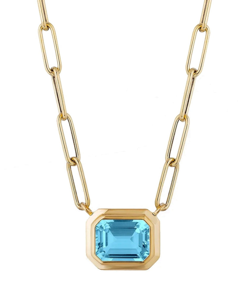 Blue Topaz emerald cut pendant in 18 karat gold chain by fine jewelry designer Goshwara