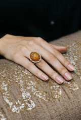 Brown Opal oval cab ring with Diamonds in 18 karat yellow gold by fine jewelry designer Goshwara