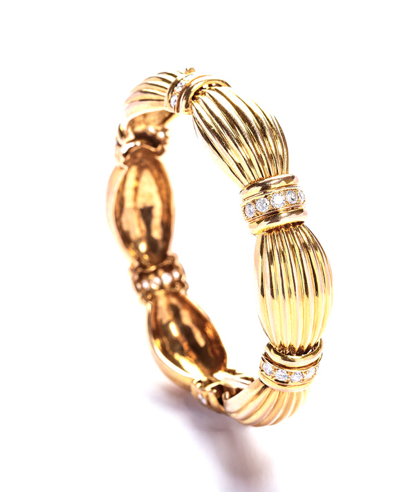 18 karat Gold Ribbon Bracelet with Diamonds by fine jewelry designer ESTAA