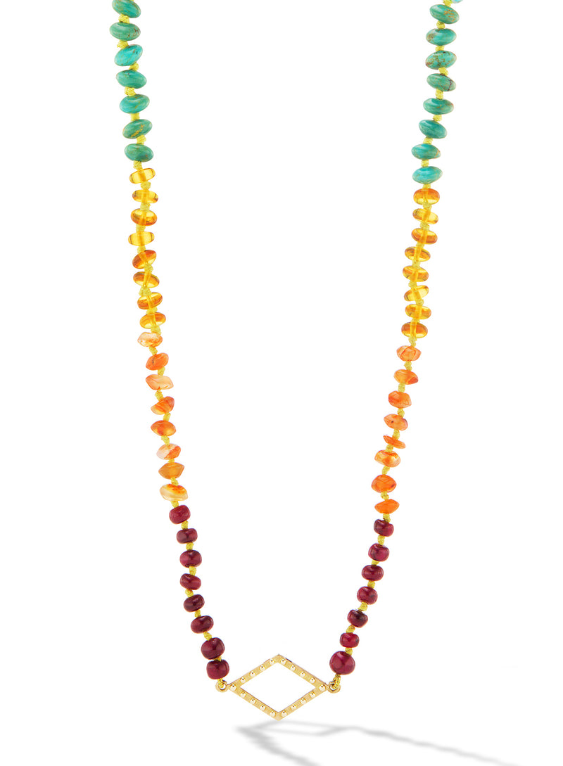 Beads necklace with rubies, carnelian, amber, green and blue Tturquoise, kyanite and amethyst by fine jewelry designer Orly Marcel. 