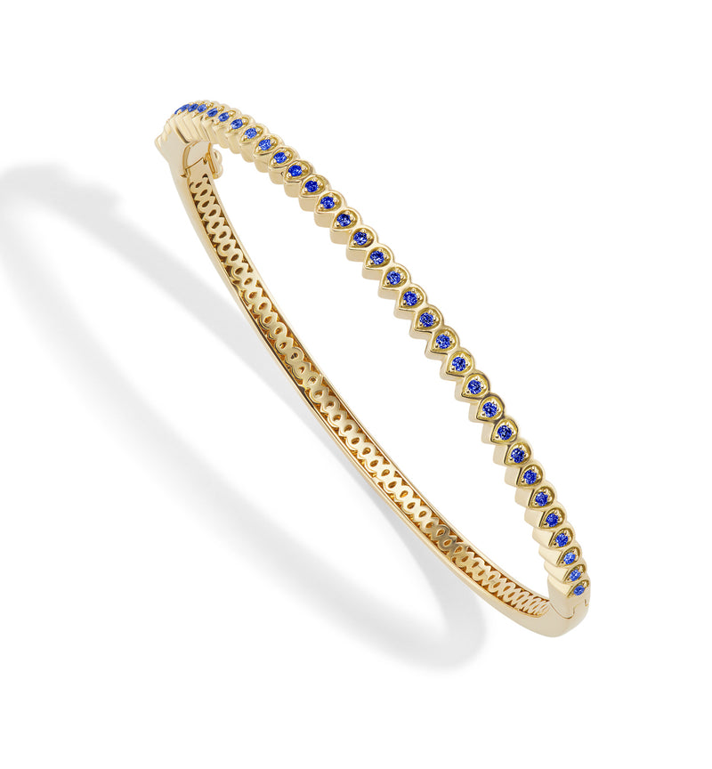 18 karat gold Mandala Petal Bangle with Blue Sapphire by fine jewelry designer Orly Marcel