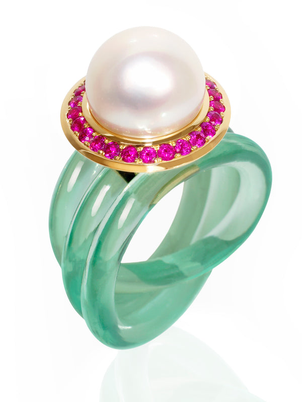White pearl set with rubies in 18 karat gold, a distinctive fine jewelry design by Monika Seitter