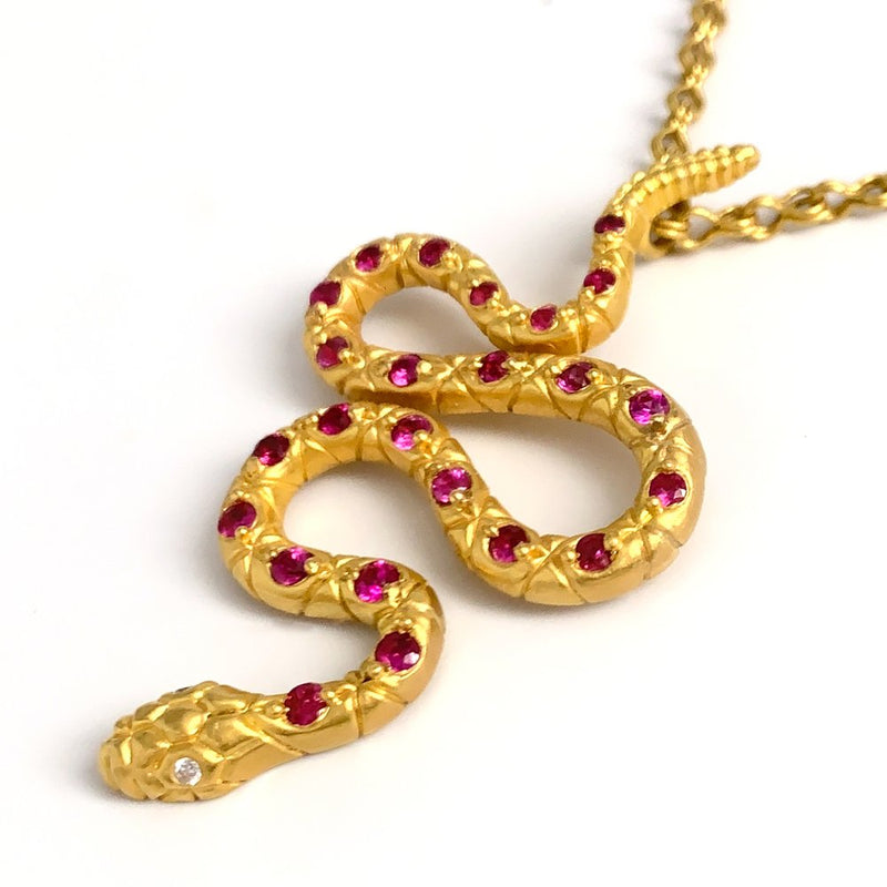 22 karat gold necklace with ruby snake pendant by jewelry designer Linda Hoj
