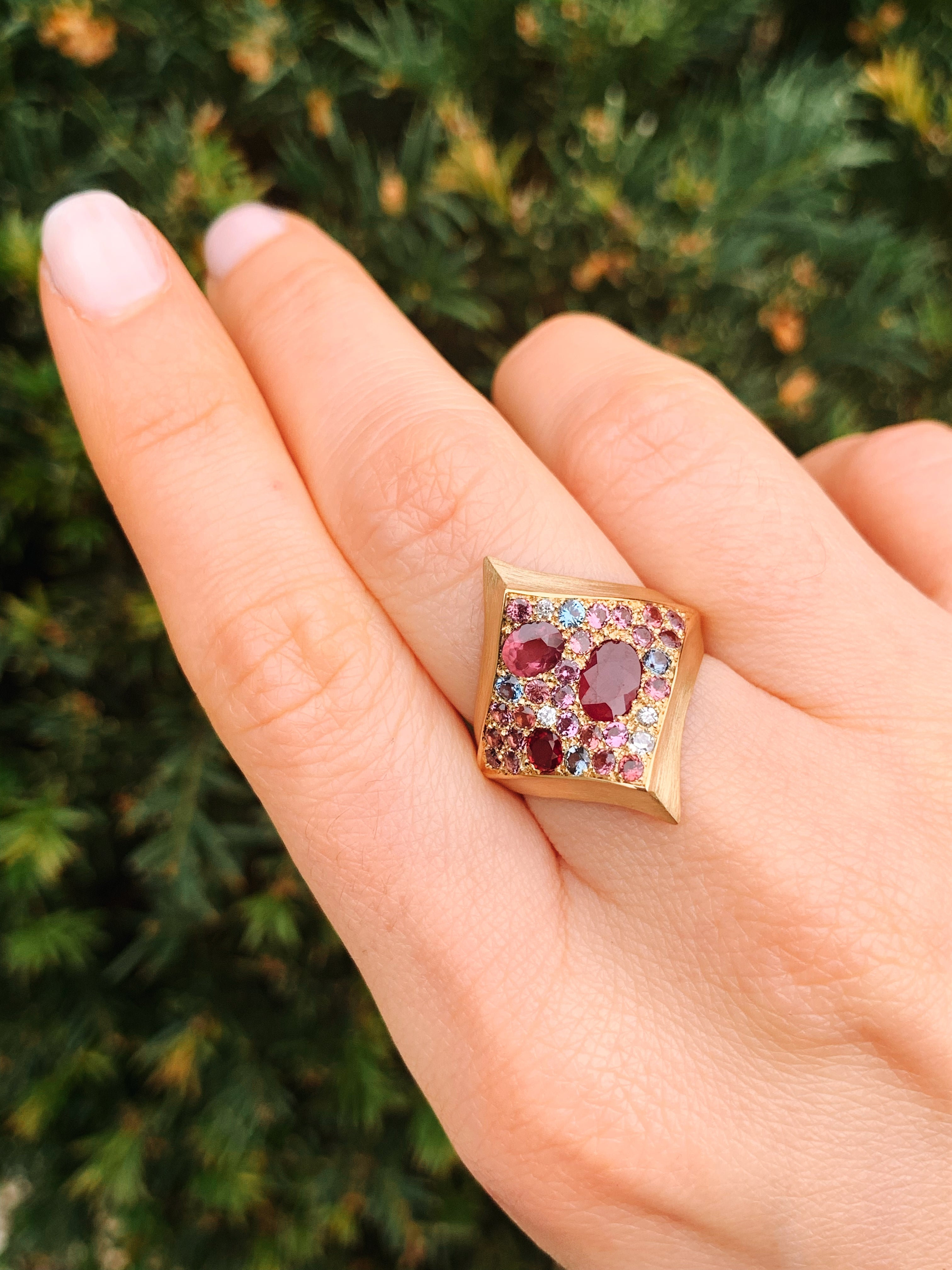 18 karat recycled rose gold ring with rubies, sapphires, diamonds, garnets, tourmaline by fine jewelry designer Capucine H