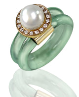 White pearl and diamond ring set in 18 karat gold with ice blue band by fine jewelry designer Monika Seitter.