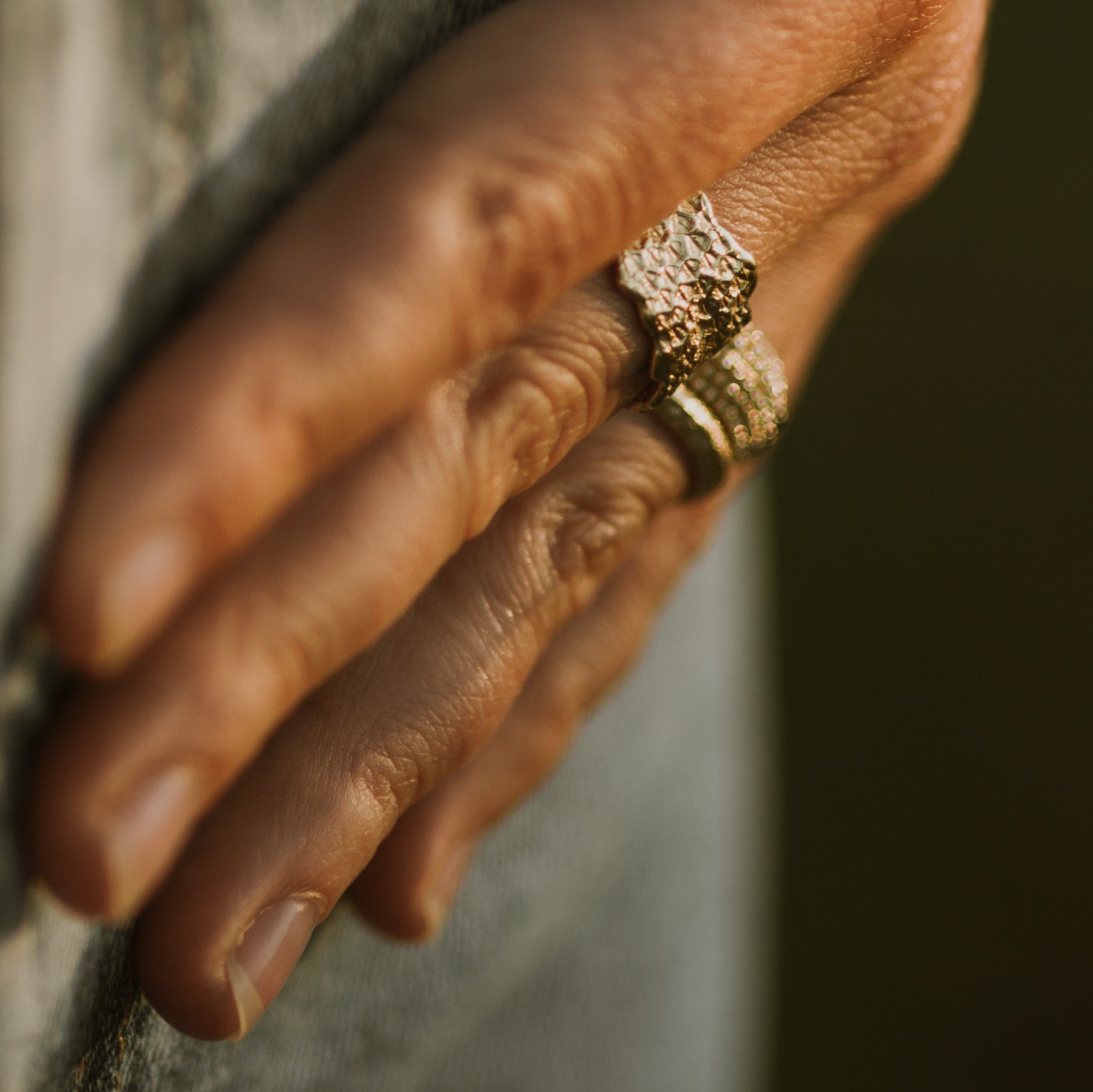 Gold textured dragon scale ring by jewelry designer-maker Clio Saskia