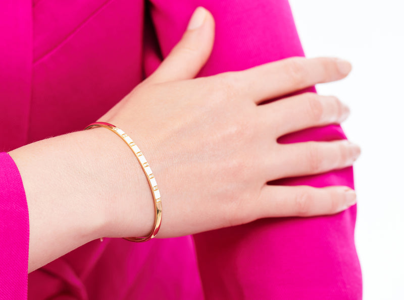 18 karat gold diamond and white enamel bracelet by fine jewelry house Van Den Abeele
