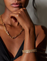18 karat gold Mandala Petal Bangle with Diamonds, Emeralds, Pink Sapphire or Blue Sapphire by fine jewelry designer Orly Marcel