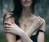22 karat gold necklace with ruby snake pendant by jewelry designer Linda Hoj