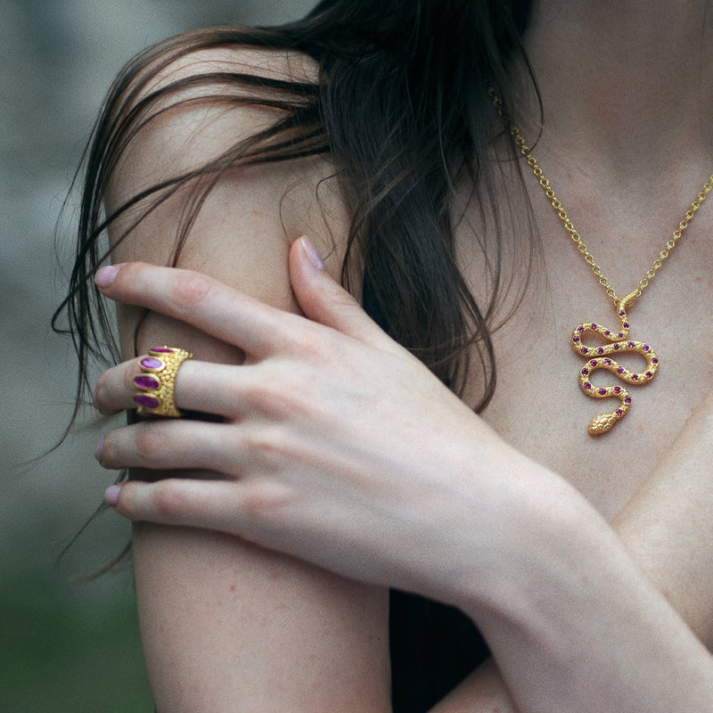 22 karat gold necklace with ruby snake pendant by jewelry designer Linda Hoj.